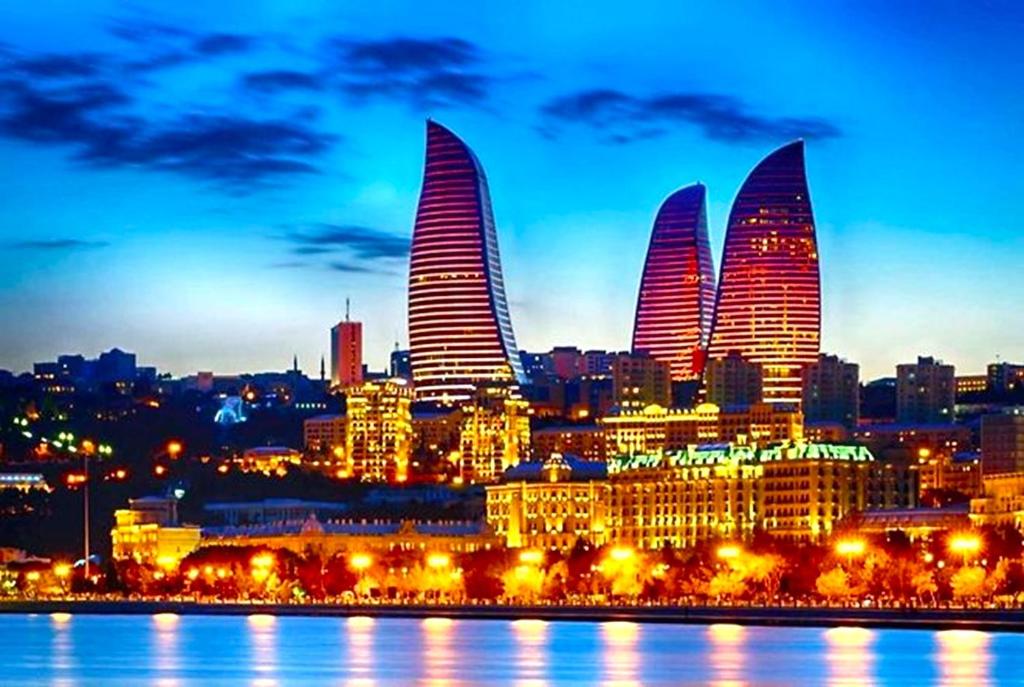 a view of a city at night with buildings at Boulevard Side Hotel in Baku