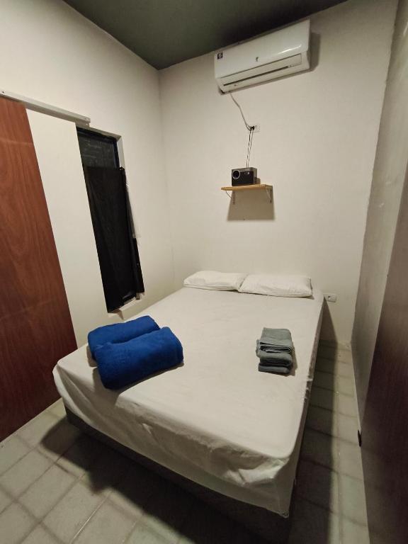 Ένα ή περισσότερα κρεβάτια σε δωμάτιο στο Suíte Natal Luz