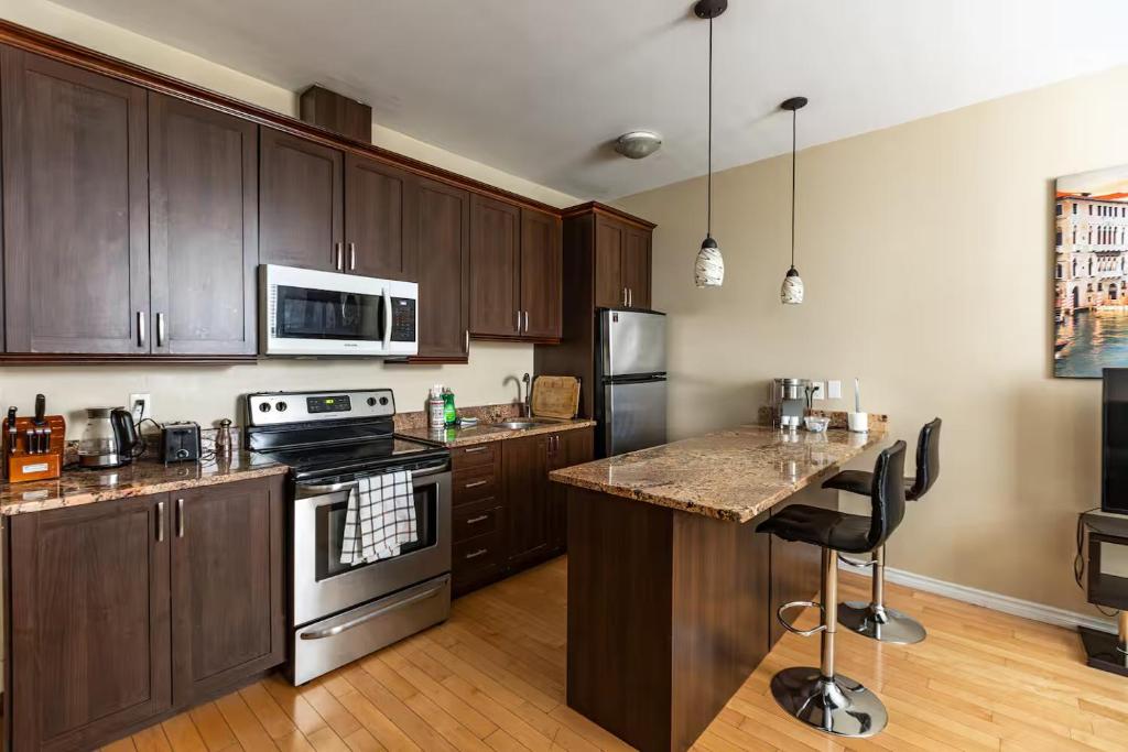 Η κουζίνα ή μικρή κουζίνα στο Suitestay Apartments Hotel