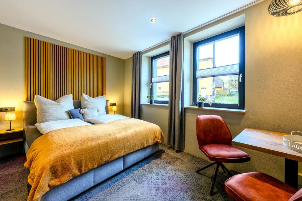 Ένα ή περισσότερα κρεβάτια σε δωμάτιο στο Pension Domquartier Naumburg