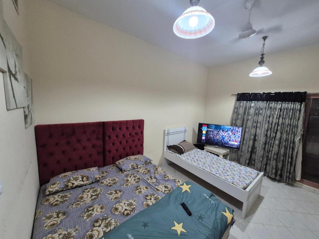 En eller flere senge i et værelse på Cozy 1 Private room with netflix