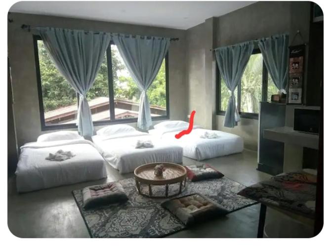 Ένα ή περισσότερα κρεβάτια σε δωμάτιο στο P&P at Pai