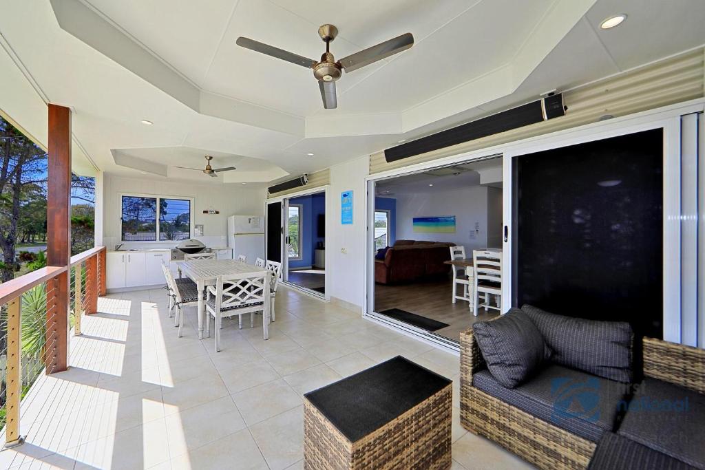 a living room with a couch and a table at 24 The Esplanade in Woodgate