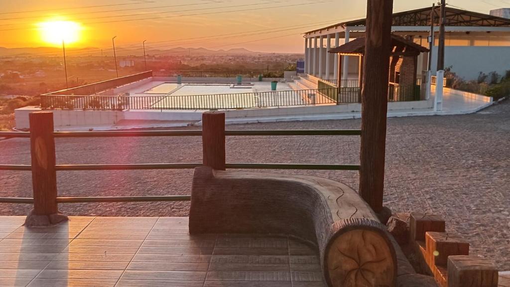 a bench in front of a skate park at sunset at Fabulosa Casa de tijolinho in Arapiraca