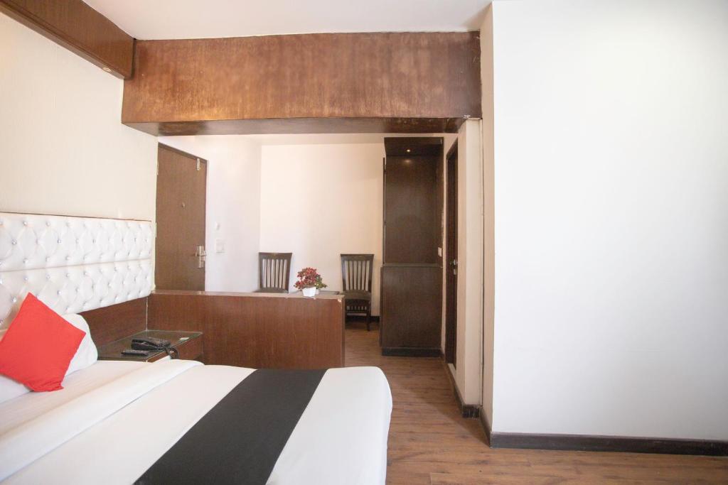 Ένα ή περισσότερα κρεβάτια σε δωμάτιο στο Hotel O Arora shoppers park