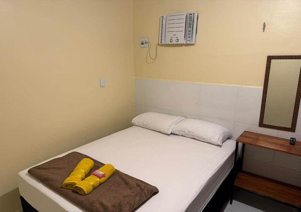 Ένα ή περισσότερα κρεβάτια σε δωμάτιο στο Figueiredo Hosp 1