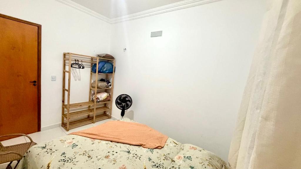 a bedroom with a bed and a closet at Grace Palace in Tigre