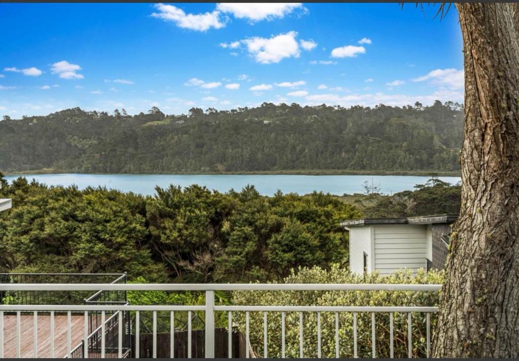 a view of a lake from a house at Cozy Water-View 2-Bdrm Suite in North Shore in Auckland