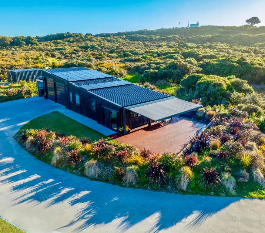 an aerial view of a house with a solarium at Lighthouse-hideaway in Cape Foulwind