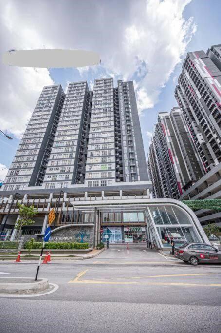 a large tall building with cars parked in front of it at Canopy Hill Kajang 2 in Kajang