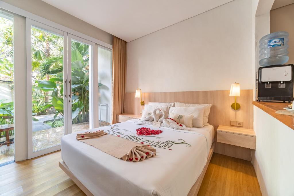 Postel nebo postele na pokoji v ubytování The Hita Apartement