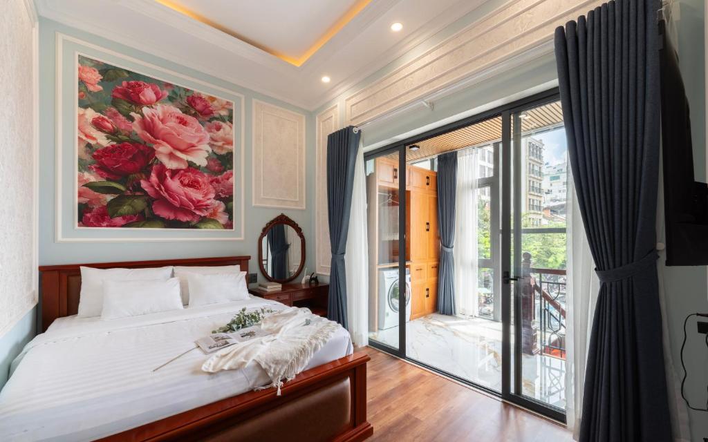 Ένα ή περισσότερα κρεβάτια σε δωμάτιο στο Ben Thanh Maison