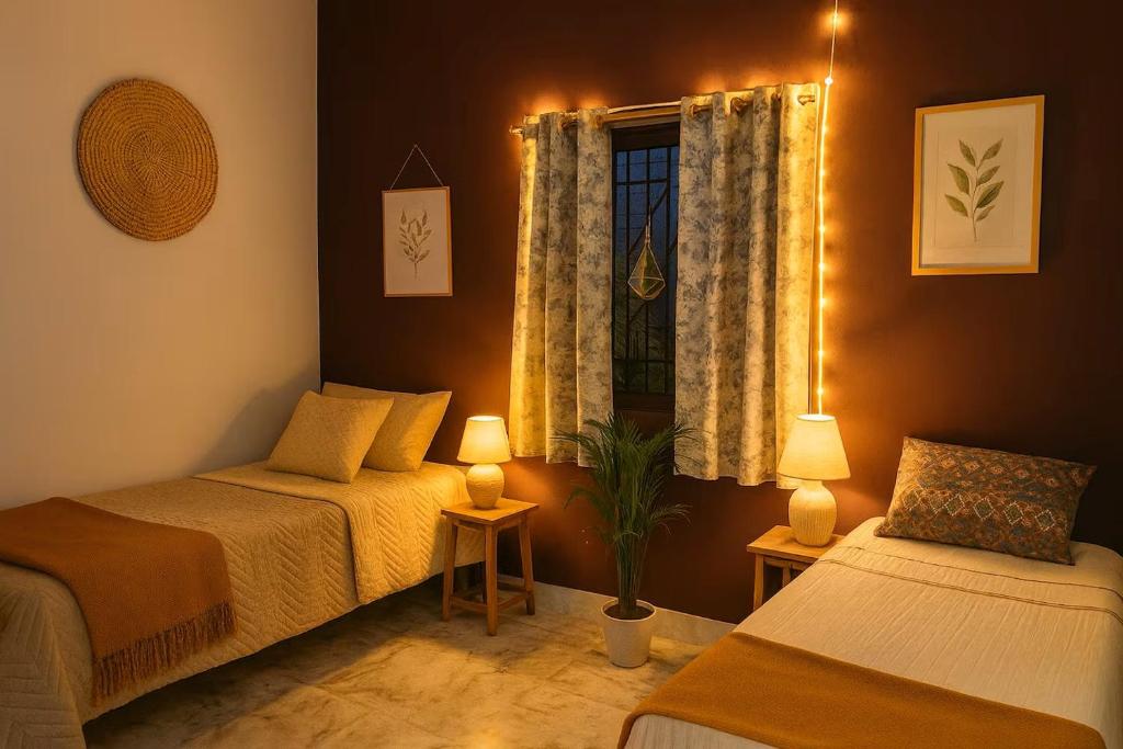 Ένα ή περισσότερα κρεβάτια σε δωμάτιο στο Grace Garden