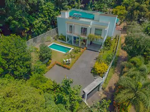 an aerial view of a house with a swimming pool at Trident Kandy in Kandy