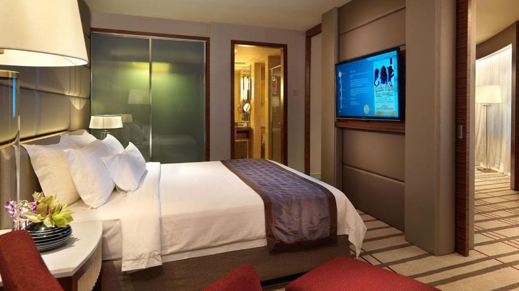 Ένα ή περισσότερα κρεβάτια σε δωμάτιο στο Indochine Hotel Hoi An