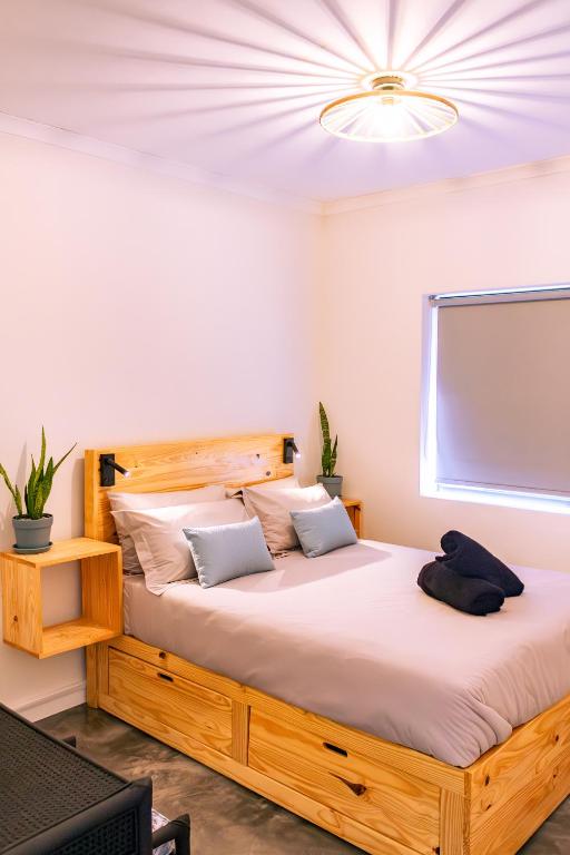 a bedroom with a large bed in a room at S Haven Luxury Self Catering Apartment in Franskraalstrand