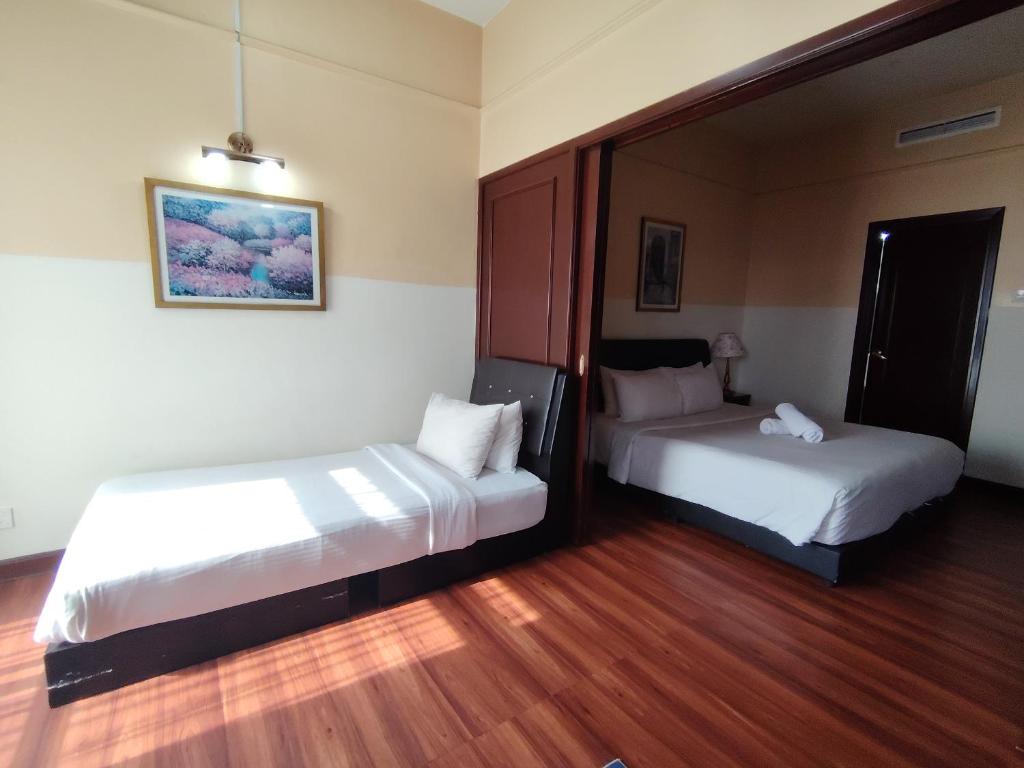 Postel nebo postele na pokoji v ubytování Kuala Lumpur Service Residence Times Square