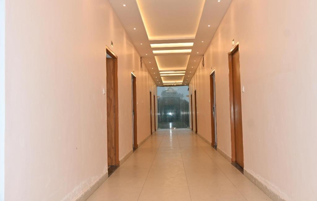 a corridor of an office building with a hallway at Malwa resort in Chitrakoot