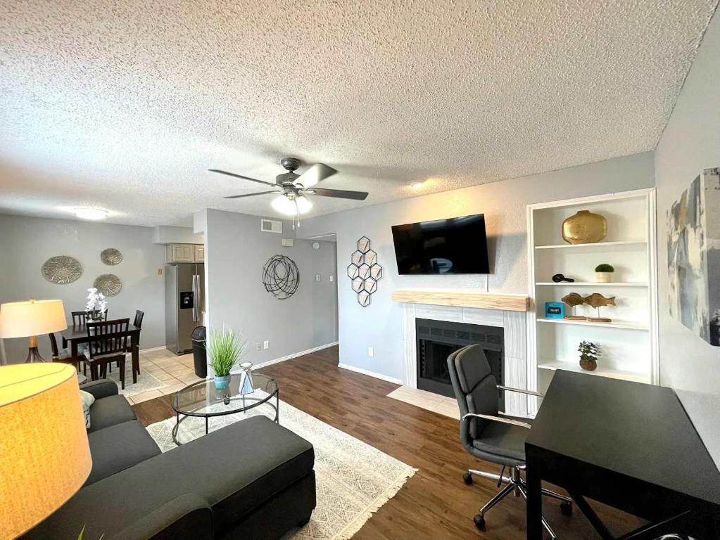 a living room with a couch and a fireplace at 1BD Condo HWY161-183 DFW South Irving - I67 in Sowers