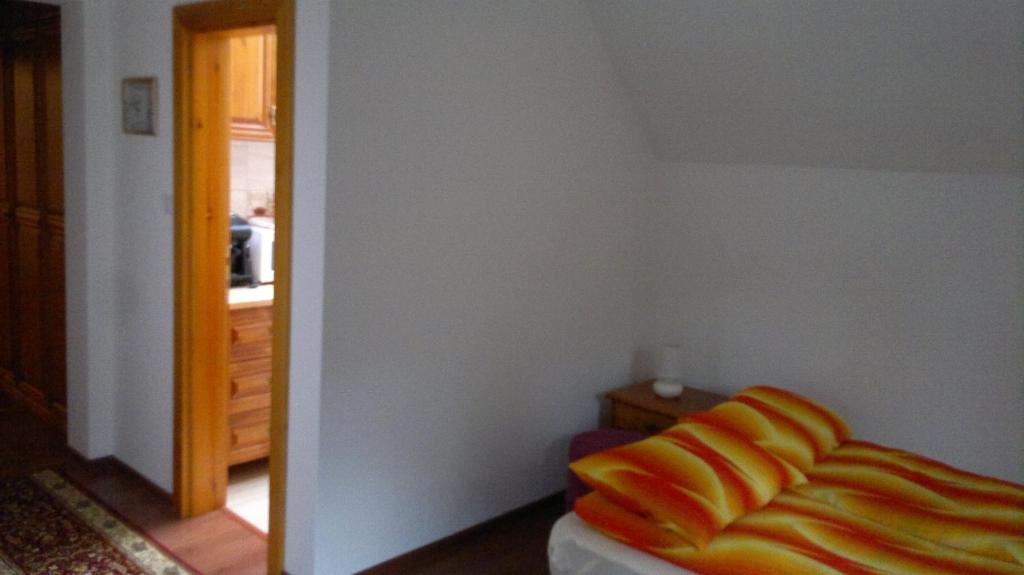 Postel nebo postele na pokoji v ubytování Imola Vendégház