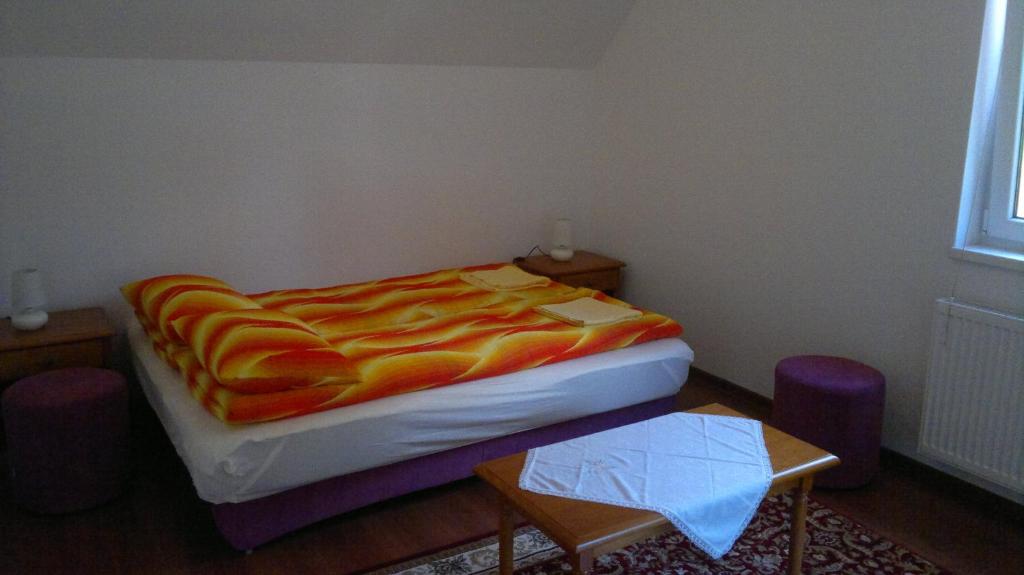 Postel nebo postele na pokoji v ubytování Imola Vendégház