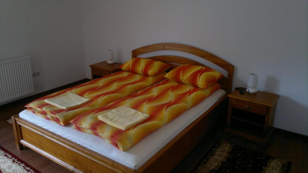 Postel nebo postele na pokoji v ubytování Imola Vendégház