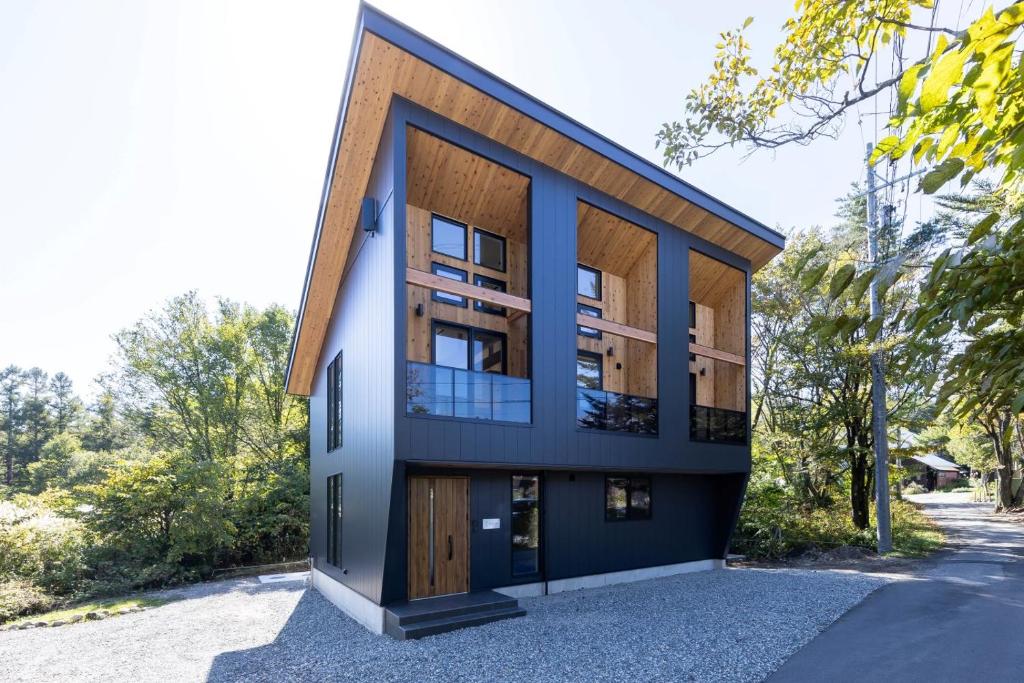 a house on the side of the road at Hakuba Mitsuki Chalet in Hakuba