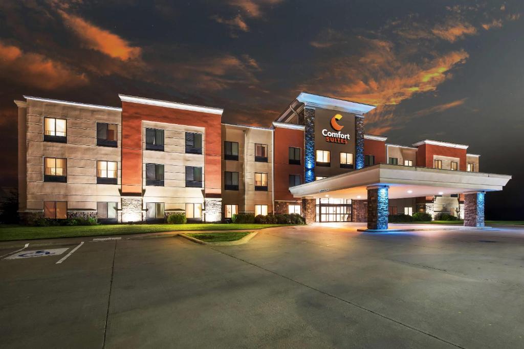 an empty parking lot in front of a hotel at Comfort Suites Gothenburg South in Gothenburg