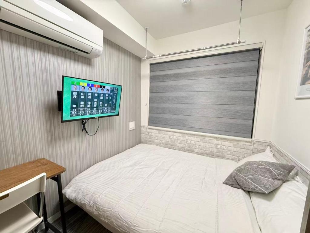 Una cama o camas en una habitación de Shinjuku downtown b3