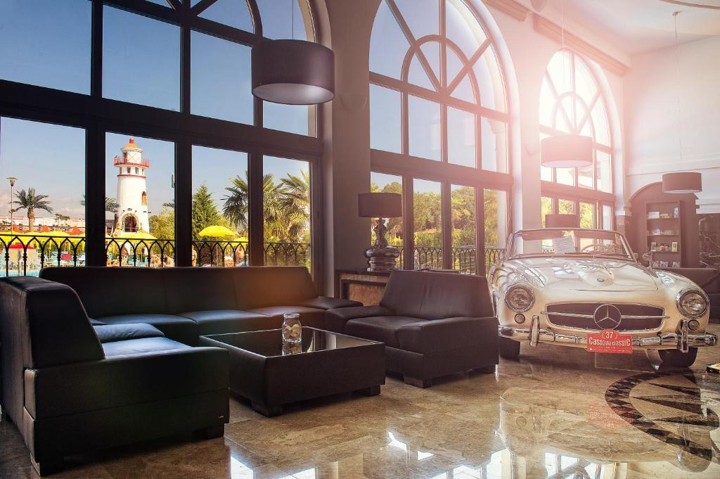 a living room with an old car and a lighthouse at Villa Plaza Boutique Hotel & Spa in Prešov