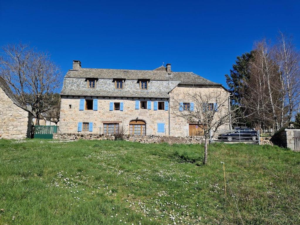 an old stone house on top of a field at Gîte de Saint-Gervais in Saint-Gervais