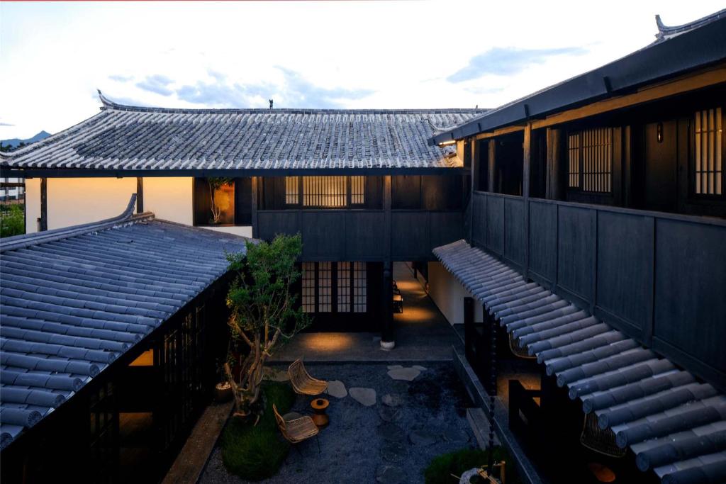 an overhead view of a building with two roofs at Silent NOISELESS Homestay in Lijiang