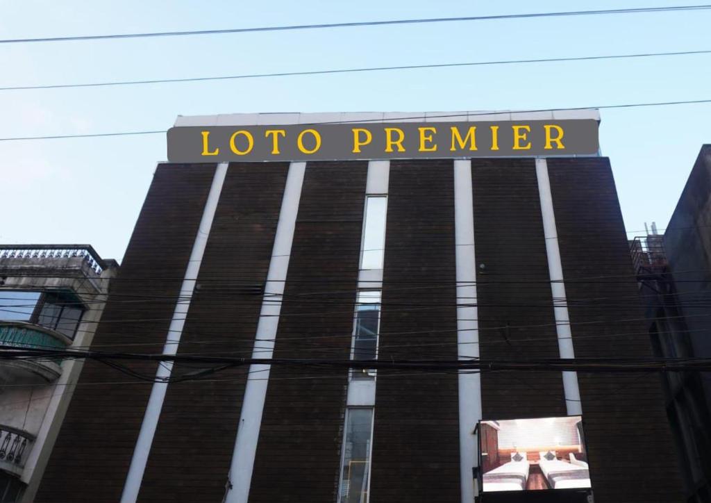 a building with a sign that reads looco premier at Hotel LOTO Premier Vijay Nagar in Jāmb