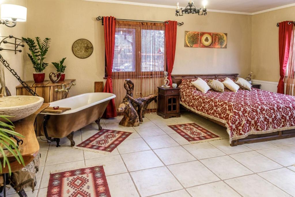 Postel nebo postele na pokoji v ubytování Rezeda Apartman