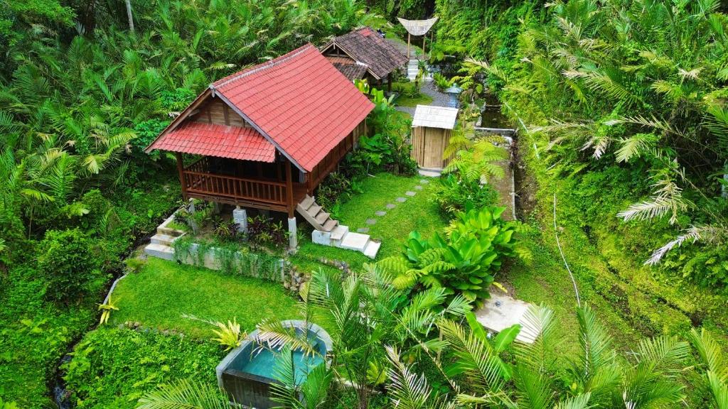 an aerial view of a house with a red roof at The Payung House in Bebandem