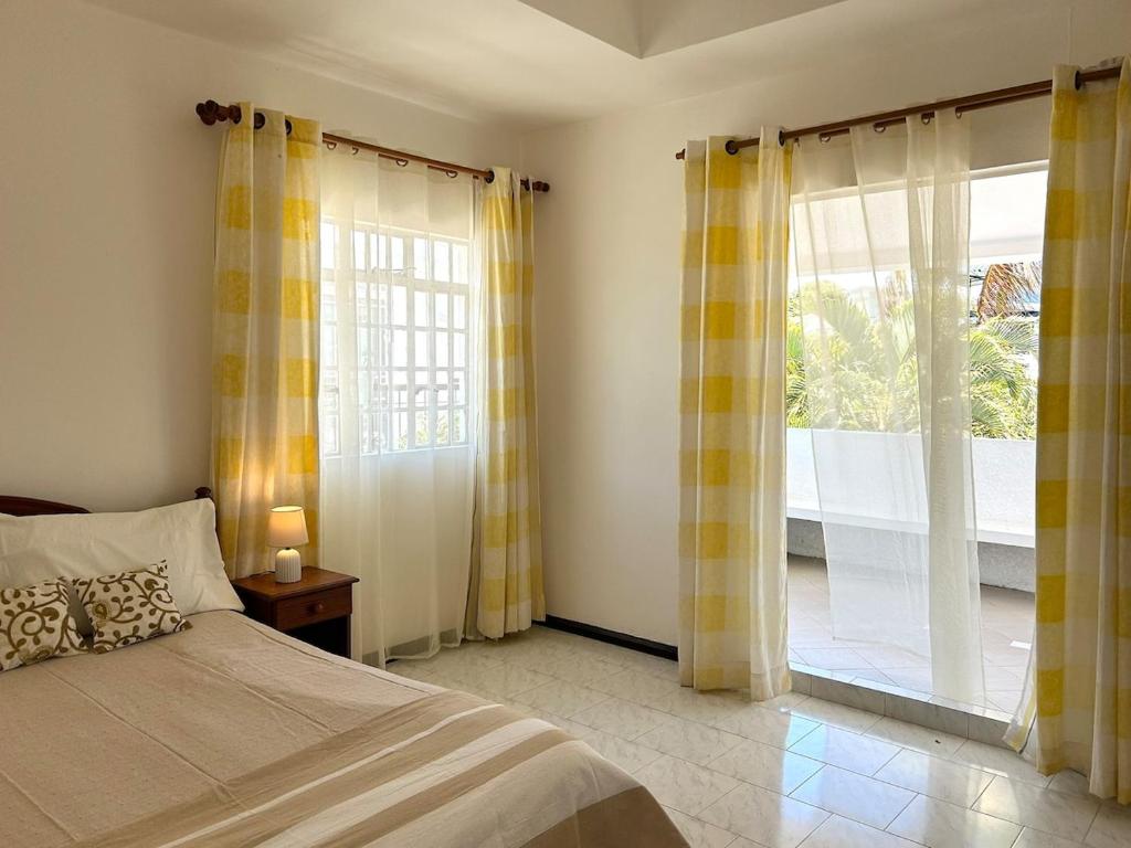 Ένα ή περισσότερα κρεβάτια σε δωμάτιο στο Villa Hacienda - Sweetness of living in Grand Gaube