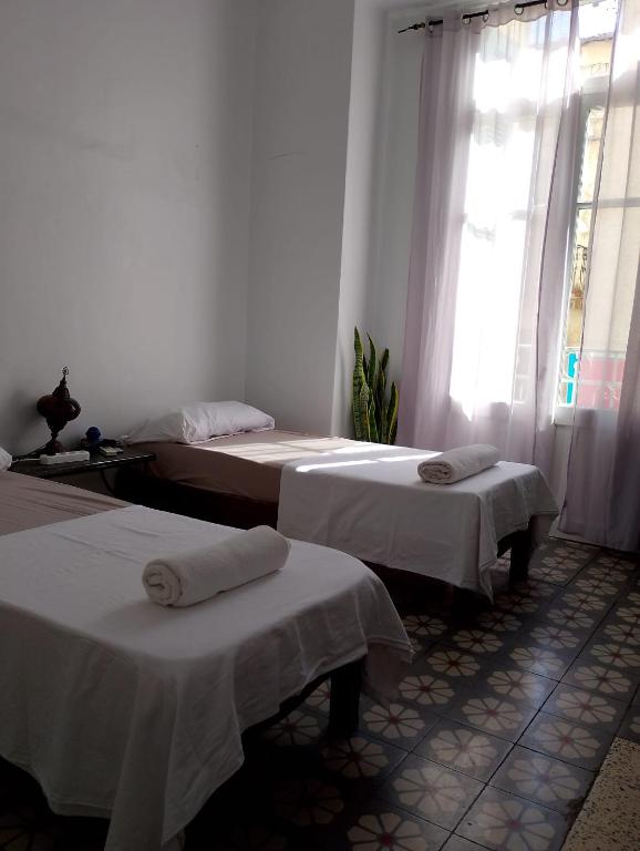 Postel nebo postele na pokoji v ubytování Urban Nest