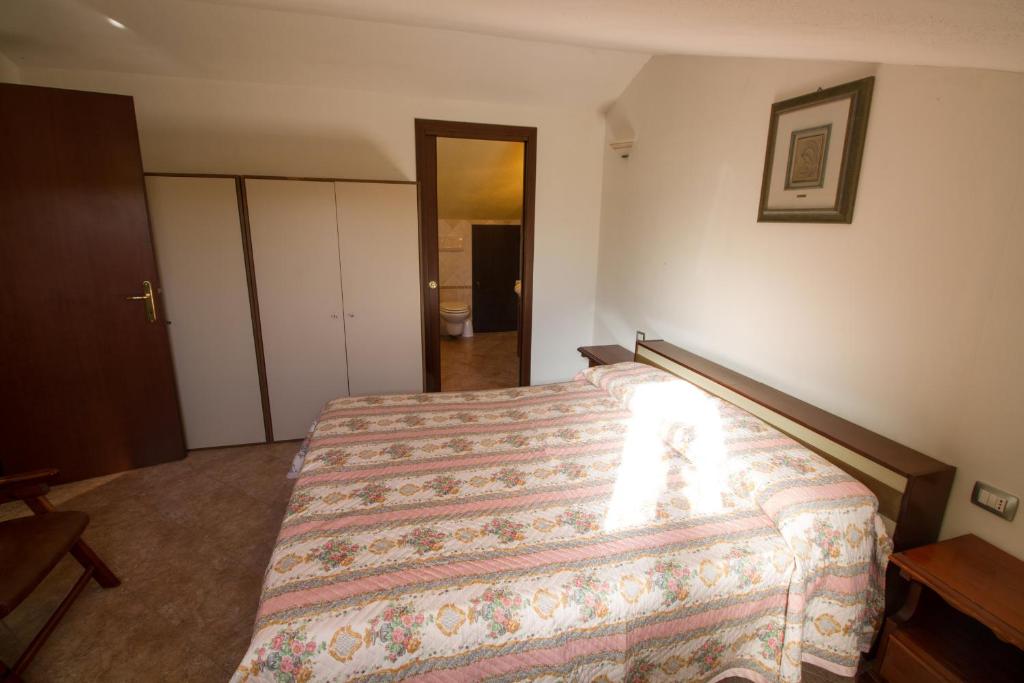 Posteľ alebo postele v izbe v ubytovaní Attico Bella Vista
