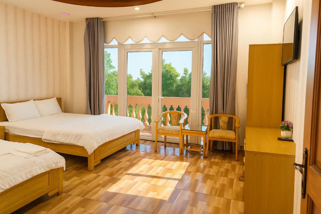 Ένα ή περισσότερα κρεβάτια σε δωμάτιο στο Phố Mới