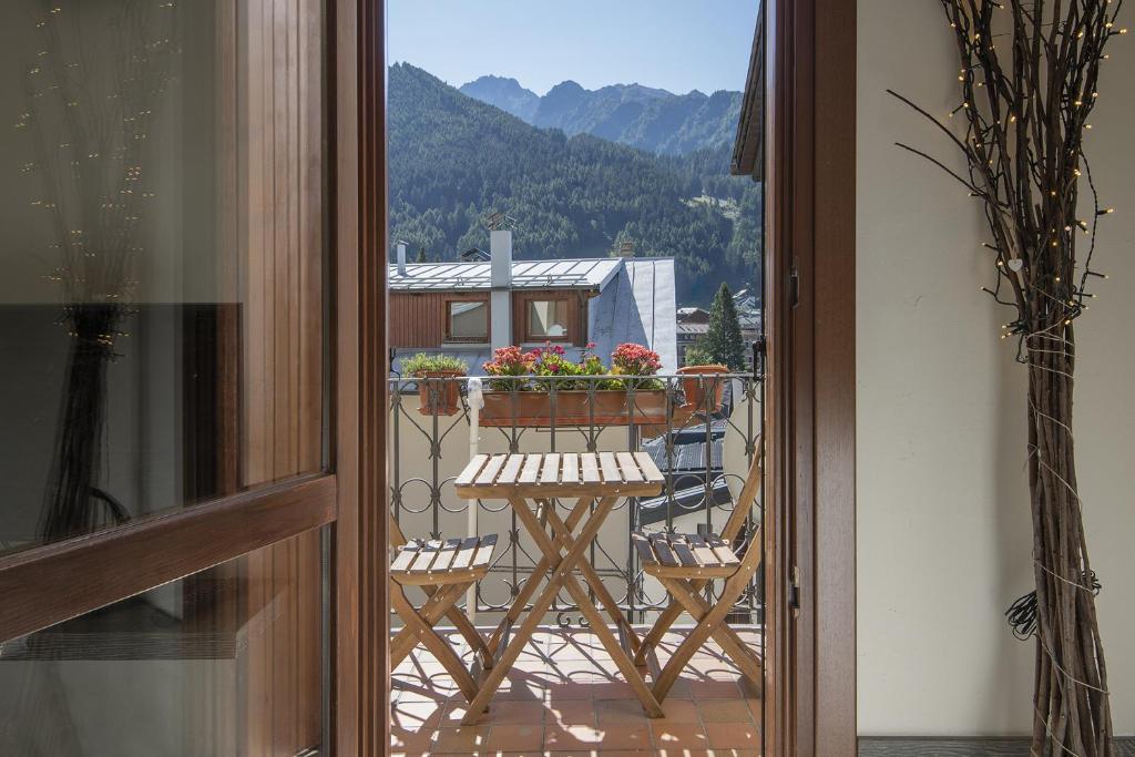 a view of a balcony with a table and chairs at Aquilegia - AffittiPontediLegno in Ponte di Legno