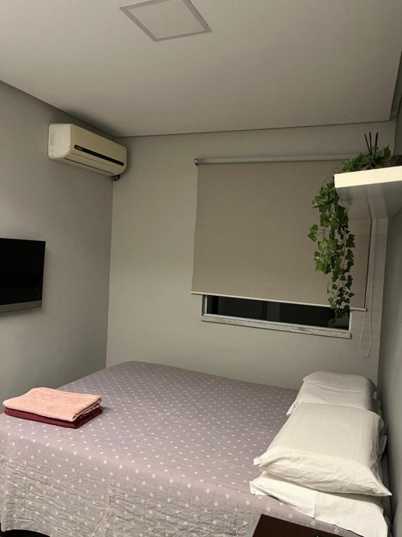 Giường trong phòng chung tại Casa aconchegante em Aracaju na Aruana