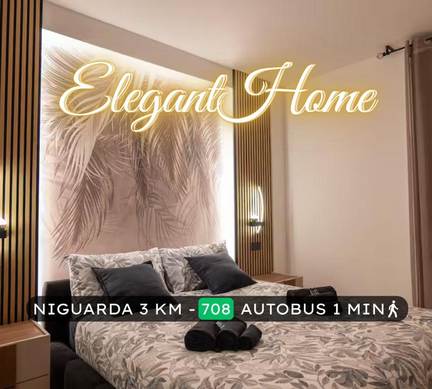 a bedroom with a bed with a sign that reads elephant home at Elegant Urban Home - Free Parking - 7min Niguarda in Bresso