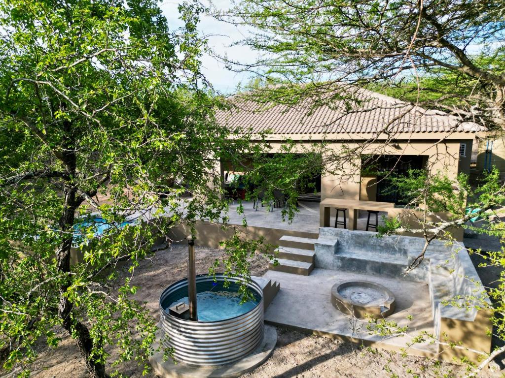 an aerial view of a house with a swimming pool at Dung Beetle Bush Villa in Marloth Park