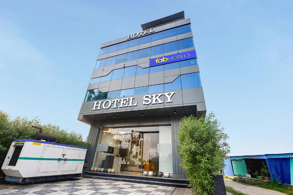 a hotel sign on the side of a building at FabHotel Sky I in Gurgaon