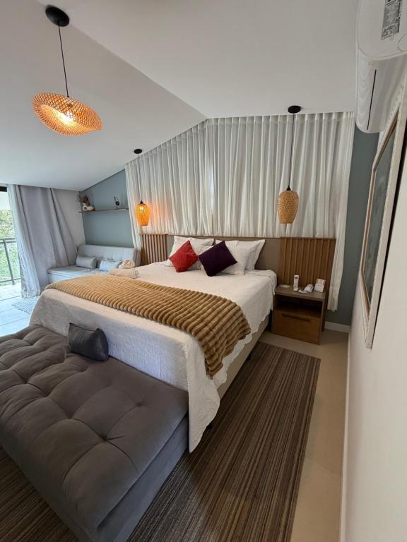 Ένα ή περισσότερα κρεβάτια σε δωμάτιο στο Pousada dos Sonhos - MP