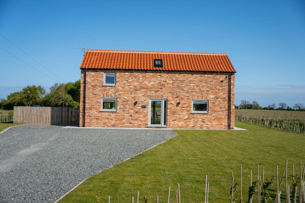 a brick house with an orange roof at Linwood in Lincoln