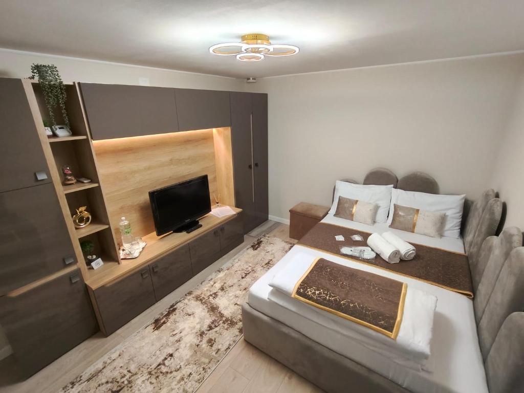 Ένα ή περισσότερα κρεβάτια σε δωμάτιο στο Delfinului Retreat