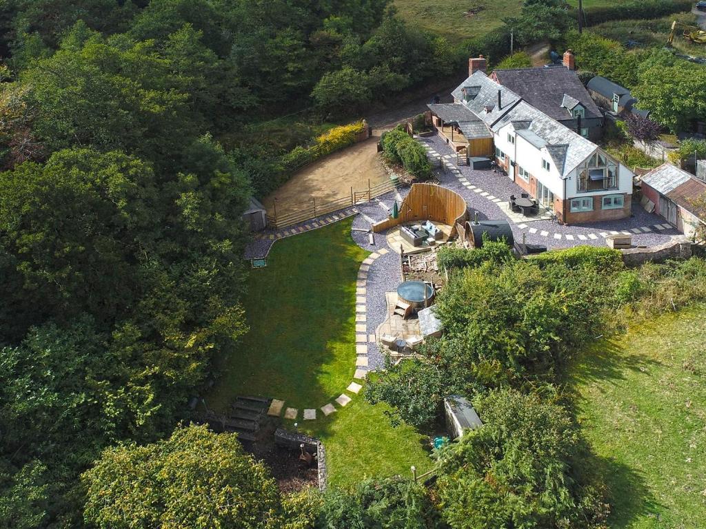 an aerial view of a house on a hill at Private lodge spa, sauna, hot tub, outdoor kitchen with firepit area in Shrewsbury