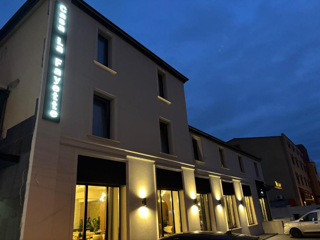 a building with a sign on the side of it at Casa La Fayette in Timişoara