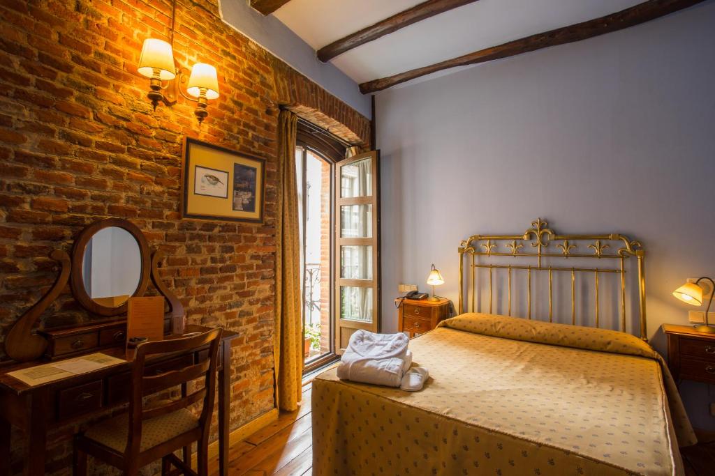 Postel nebo postele na pokoji v ubytování Hotel La Posada Regia